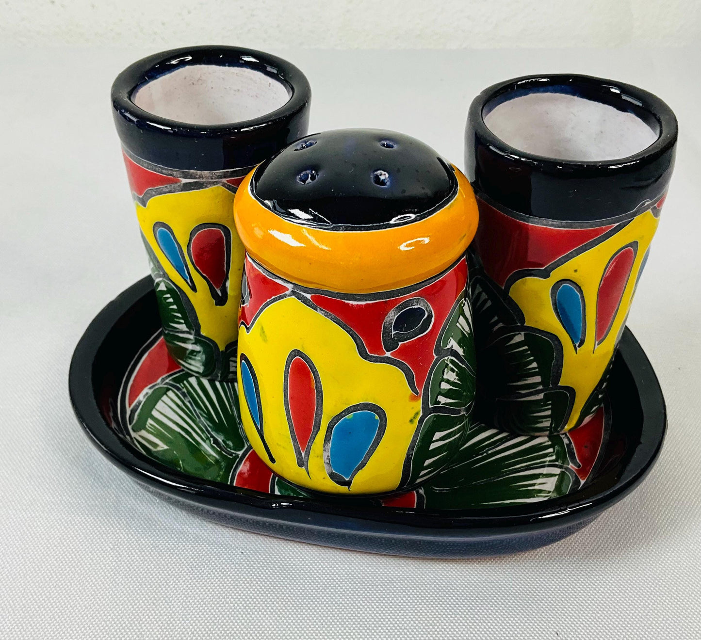 Set of tequila glasses with salt shaker