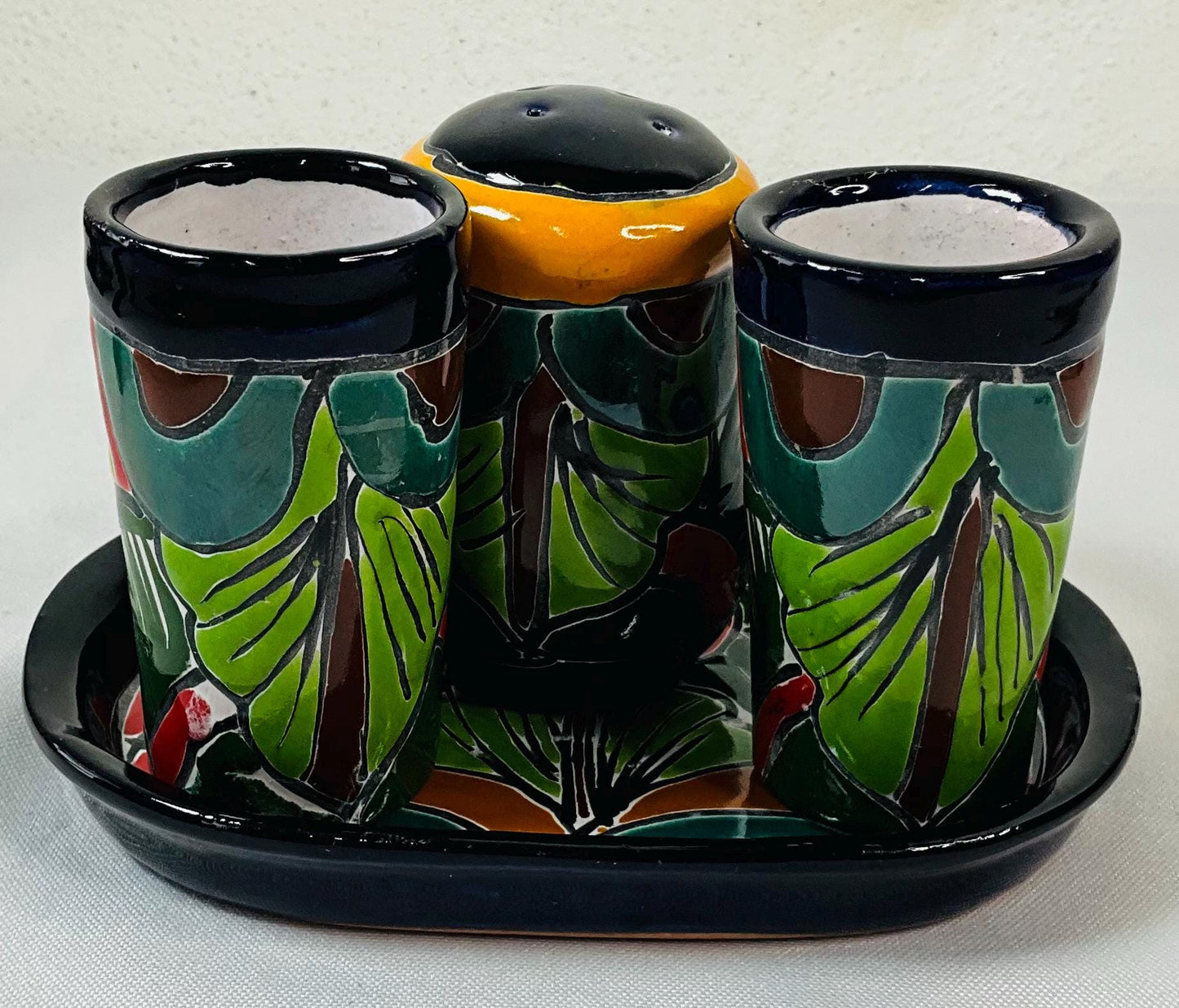 Set of tequila glasses with salt shaker