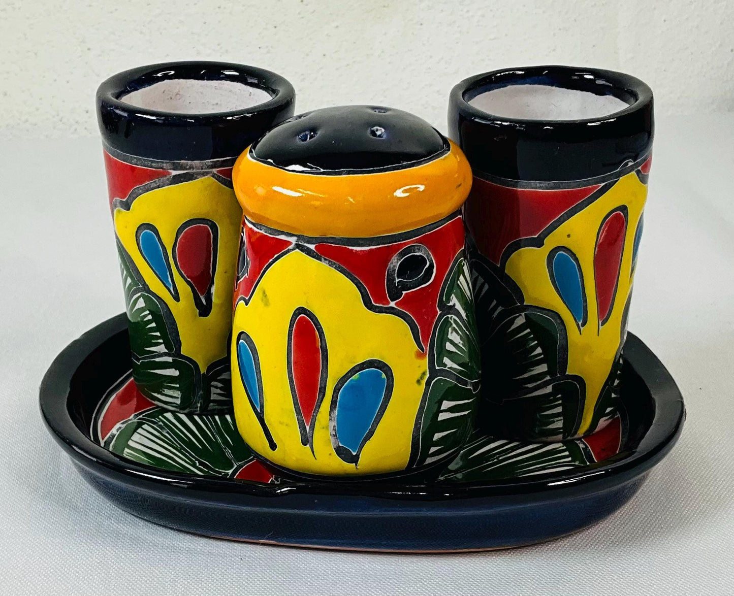 Set of tequila glasses with salt shaker